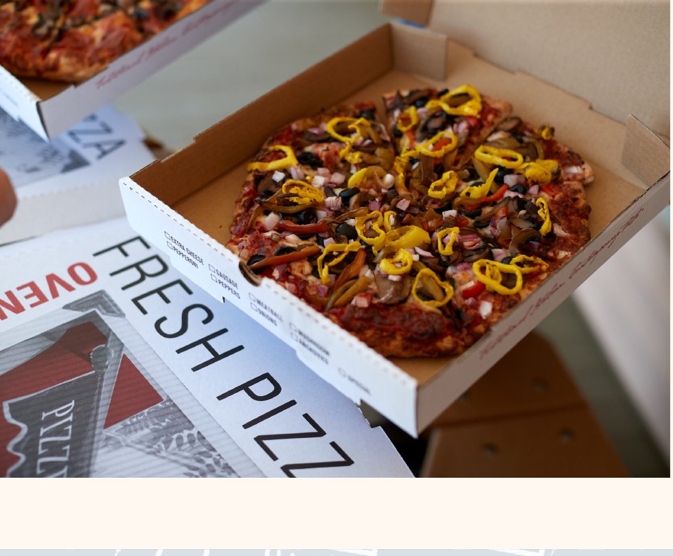 Fresh pizza in an oven-fresh box