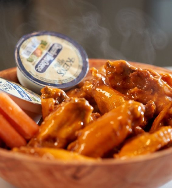 Bowl of freshly sauced chicken wings